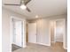 Spacious bedroom featuring a ceiling fan, plush carpet, and a walk-in closet for ample storage at 1305 W 23Rd St, Indianapolis, IN 46208
