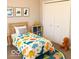 Playful bedroom with dinosaur-themed decor, a cozy bed, and a spacious closet at 1305 W 23Rd St, Indianapolis, IN 46208