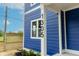 Close up of the front of a blue home with white trim and black house numbers at 1305 W 23Rd St, Indianapolis, IN 46208