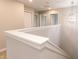 Bright hallway with a modern chandelier and white trim, leading to other rooms at 1305 W 23Rd St, Indianapolis, IN 46208