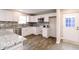 Lovely kitchen boasting granite countertops, stainless appliances, and a back door at 1305 W 23Rd St, Indianapolis, IN 46208