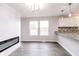 Open kitchen featuring granite counters, stainless steel appliances, and new light fixtures at 1305 W 23Rd St, Indianapolis, IN 46208