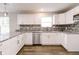 Well-lit kitchen with stainless appliances, granite countertops, and sleek cabinetry at 1305 W 23Rd St, Indianapolis, IN 46208