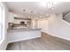 Modern kitchen with granite countertops, stainless appliances, and stylish lighting at 1305 W 23Rd St, Indianapolis, IN 46208