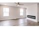 Bright and airy living room with modern fireplace, recessed lighting, and wood-look flooring at 1305 W 23Rd St, Indianapolis, IN 46208