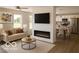 Bright and inviting living room with fireplace, open to the modern kitchen and dining area at 1305 W 23Rd St, Indianapolis, IN 46208