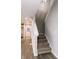 Carpeted stairway leading upstairs with a view of the entry door at 1305 W 23Rd St, Indianapolis, IN 46208
