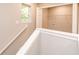 Spacious walk in closet with window, shelving, and electrical outlets at 1305 W 23Rd St, Indianapolis, IN 46208