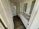 Bathroom features double sinks, white cabinets, and glass enclosed shower at 1704 N Winthrop Rd, Muncie, IN 47304