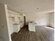 Bright kitchen features white cabinetry, stainless steel sink, and open layout at 1704 N Winthrop Rd, Muncie, IN 47304