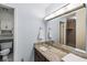 Bathroom featuring a granite countertop and a decorative mirror at 2207 Rome Dr # B, Indianapolis, IN 46228