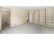 Spacious bedroom includes built-in shelving and doorway to a closet or ensuite at 2207 Rome Dr # B, Indianapolis, IN 46228