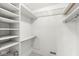 Organized walk-in closet features shelving and hanging space for optimal storage at 2207 Rome Dr # B, Indianapolis, IN 46228