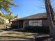 Charming brick facade with lush landscaping and ample light, creating inviting curb appeal at 2207 Rome Dr # B, Indianapolis, IN 46228