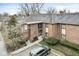 Brick condo building with well-maintained landscaping, sidewalk and ample parking at 2207 Rome Dr # B, Indianapolis, IN 46228