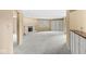 Open living room with a decorative fireplace, built-in shelving, and neutral carpeting at 2207 Rome Dr # B, Indianapolis, IN 46228