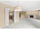 Spacious living room features plush carpeting and a decorative fireplace at 2207 Rome Dr # B, Indianapolis, IN 46228