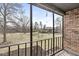 Cozy patio features a railing and outdoor space surrounded by green landscape at 2207 Rome Dr # B, Indianapolis, IN 46228