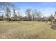 A well-maintained grassed condo community featuring mature trees and common areas at 2207 Rome Dr # B, Indianapolis, IN 46228
