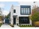 Modern two-story home with stone and siding, black-framed windows, and manicured landscaping at 2719 Carrollton Ave, Indianapolis, IN 46205