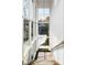 Bright staircase features an abundance of natural light from large windows and modern light fixture at 2719 Carrollton Ave, Indianapolis, IN 46205