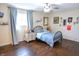 Bedroom with hardwood floors, a bed, window and an abundance of natural light at 2847 Merts Dr, Indianapolis, IN 46237