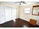 Bedroom features hardwood floors, closet, ceiling fan, and a window for natural light at 2847 Merts Dr, Indianapolis, IN 46237