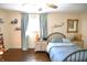 Comfortable bedroom with warm colors and natural light from a large window at 2847 Merts Dr, Indianapolis, IN 46237