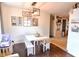 Open dining area with bench seating, modern lighting, and stylish decor at 2847 Merts Dr, Indianapolis, IN 46237