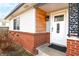 Charming front door with decorative welcome sign, brick accents, and fresh paint at 2847 Merts Dr, Indianapolis, IN 46237