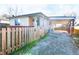 Charming home featuring a covered carport, decorative porch columns, and a fenced yard at 2847 Merts Dr, Indianapolis, IN 46237