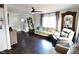 Cozy living room featuring hardwood floors, a ceiling fan, and comfortable seating at 2847 Merts Dr, Indianapolis, IN 46237