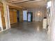 A large, unfinished basement with a sliding wood barn door to a storage area or closet at 3060 N Alaska Rd, Cloverdale, IN 46120