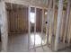Bedroom under construction showing the window, wall studs, insulation, and electrical wiring at 3060 N Alaska Rd, Cloverdale, IN 46120