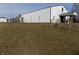 Exterior view of the white house and the surrounding property at 3060 N Alaska Rd, Cloverdale, IN 46120