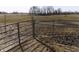 View of the pasture with metal fencing in the foreground at 3060 N Alaska Rd, Cloverdale, IN 46120