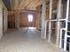 View of a room under construction with a staircase, HVAC, and electrical components at 3060 N Alaska Rd, Cloverdale, IN 46120
