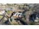 Stunning home with a circular driveway, lush landscape, and brick facade at 3370 Walnut Creek Ct, Carmel, IN 46032
