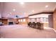 Spacious finished basement with a fireplace, bar, and ample room for entertaining at 3370 Walnut Creek Ct, Carmel, IN 46032