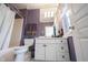 Bathroom featuring a shower/tub combination, vanity with storage, and purple polka dot wallpaper at 3370 Walnut Creek Ct, Carmel, IN 46032