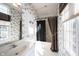 Charming bathroom features patterned wallpaper, a large window, and a classic sink and vanity at 3370 Walnut Creek Ct, Carmel, IN 46032