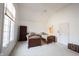 Bright bedroom with two beds, a ceiling fan, and a bookcase at 3370 Walnut Creek Ct, Carmel, IN 46032