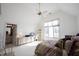 Bedroom with a sloped ceiling features a built-in desk, a large window, and neutral decor at 3370 Walnut Creek Ct, Carmel, IN 46032