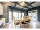 Bright dining area with table, chairs, and a large window overlooking the backyard at 3370 Walnut Creek Ct, Carmel, IN 46032