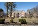 A beautiful home with a brick exterior, well-manicured lawn, and mature trees at 3370 Walnut Creek Ct, Carmel, IN 46032