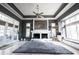 Comfortable living room with a large fireplace, lots of windows, and stylish décor at 3370 Walnut Creek Ct, Carmel, IN 46032