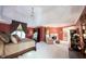 This spacious main bedroom features a fireplace, a large window, and neutral decor at 3370 Walnut Creek Ct, Carmel, IN 46032