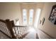 Bright foyer staircase with carpet runner and transom windows at 3370 Walnut Creek Ct, Carmel, IN 46032