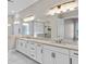 Bright bathroom with double sinks, granite countertops, and a spacious walk-in shower at 4248 Stone Lake Dr, Zionsville, IN 46077