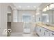 Modern bathroom featuring a large walk-in shower with elegant marble tile and double vanity at 4248 Stone Lake Dr, Zionsville, IN 46077